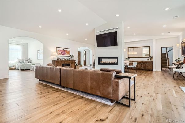 Dining room, Fireplace, Interior, Living room, Recessed Lighting, Wood Texture Flooring