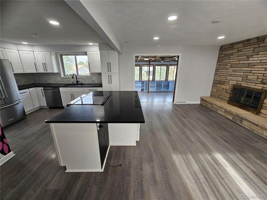 Fireplace, Interior, Kitchen, Recessed Lighting, Stone Walls, Wood Texture Flooring