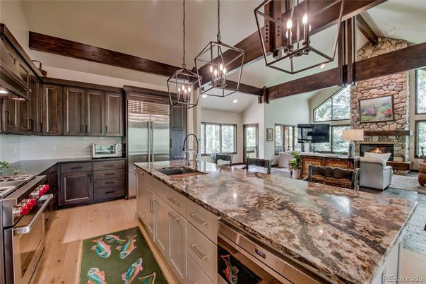 Fireplace, Interior, Kitchen, Living room, Pendant Lights, Stainless Steel Appliances, Stone Walls, Wooden Beams, Wood Texture Flooring