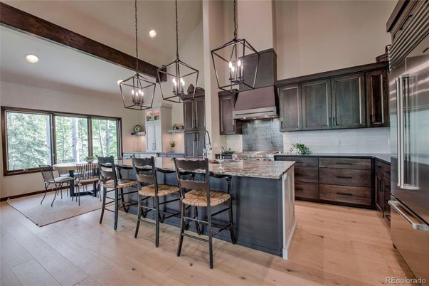 Dining room, Interior, Kitchen, Pendant Lights, Recessed Lighting, Stainless Steel Appliances, Wooden Beams, Wood Texture Flooring