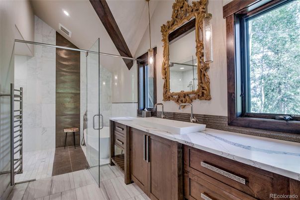 Bathroom, Dual Sink Vanities, Glass Shower, Interior, Marble, Marble Walls, Recessed Lighting, Wooden Beams