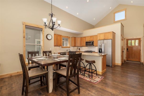 Chandelier, Dining room, Interior, Kitchen, Recessed Lighting, Stainless Steel Appliances, Wood Texture Flooring