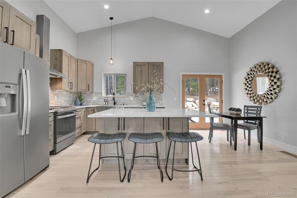 Dining room, Interior, Kitchen, Pendant Lights, Recessed Lighting, Stainless Steel Appliances, Wood Texture Flooring