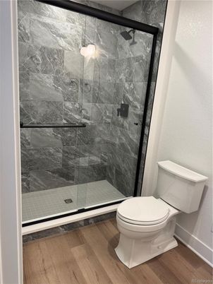 Bathroom, Glass Shower, Interior, Marble Walls, Wood Texture Flooring