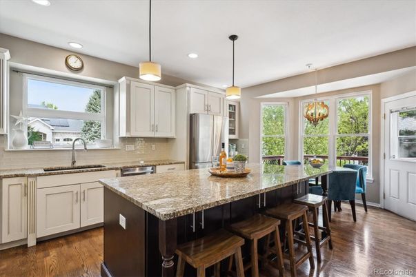 Dining room, Interior, Kitchen, Pendant Lights, Recessed Lighting, Stainless Steel Appliances, Wood Texture Flooring