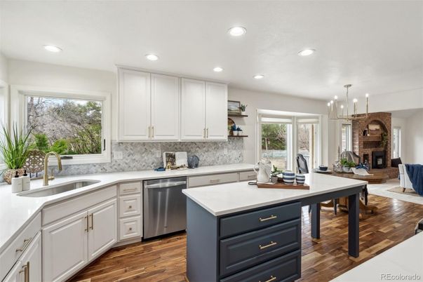 Dining room, Fireplace, Interior, Kitchen, Pendant Lights, Recessed Lighting, Stainless Steel Appliances, Wood Texture Flooring