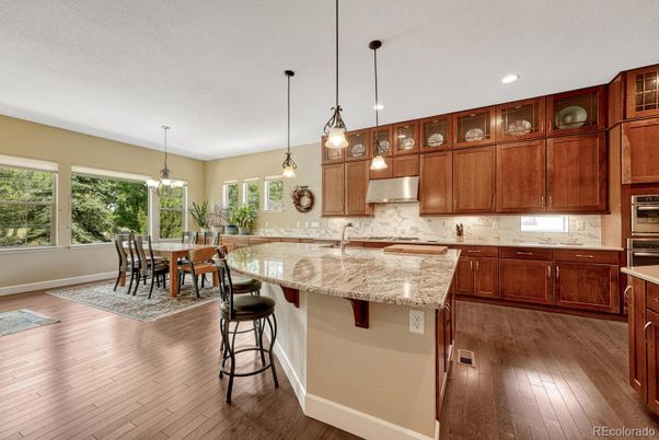 Chandelier, Dining room, Interior, Kitchen, Pendant Lights, Recessed Lighting, Stainless Steel Appliances, Wood Texture Flooring