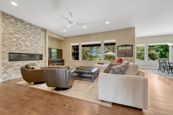 Fireplace, Interior, Living room, Recessed Lighting, Stone Walls, Wood Texture Flooring
