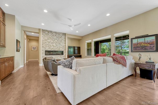 Fireplace, Interior, Living room, Recessed Lighting, Stone Walls, Wood Texture Flooring