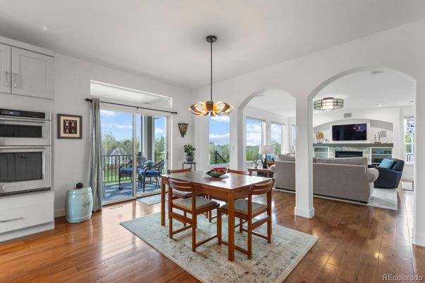Dining room, Fireplace, Interior, Living room, Pendant Lights, Recessed Lighting, Wood Texture Flooring