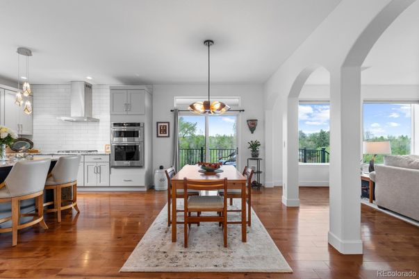 Dining room, Interior, Kitchen, Pendant Lights, Recessed Lighting, Stainless Steel Appliances, Wood Texture Flooring