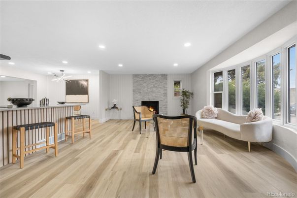 Fireplace, Interior, Living room, Recessed Lighting, Stone Walls, Wood Texture Flooring