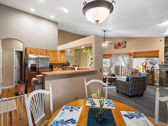 Dining room, Fireplace, Interior, Kitchen, Living room, Recessed Lighting, Stainless Steel Appliances, Wood Texture Flooring