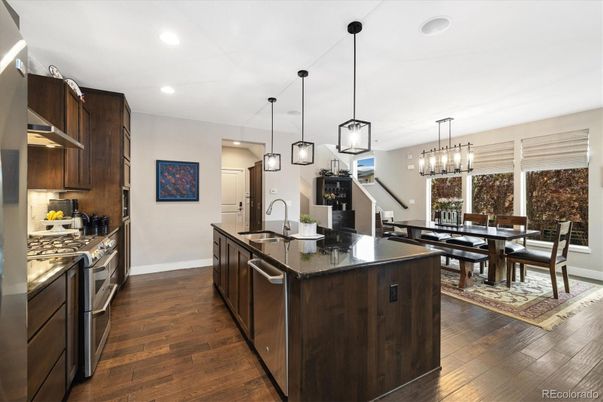 Chandelier, Dining room, Interior, Kitchen, Pendant Lights, Recessed Lighting, Stainless Steel Appliances, Wood Texture Flooring