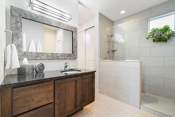 Bathroom, Dual Sink Vanities, Glass Shower, Interior, Recessed Lighting, Wood Texture Flooring