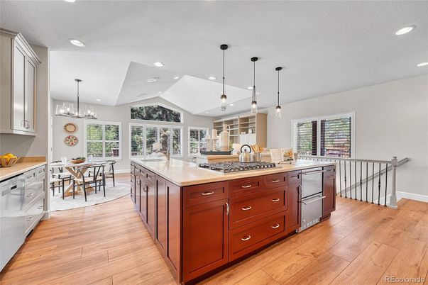 Dining room, Interior, Kitchen, Pendant Lights, Recessed Lighting, Stainless Steel Appliances, Wood Texture Flooring