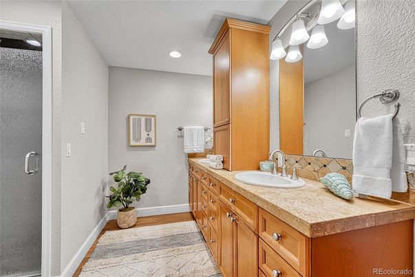 Bathroom, Dual Sink Vanities, Interior, Recessed Lighting, Wood Texture Flooring