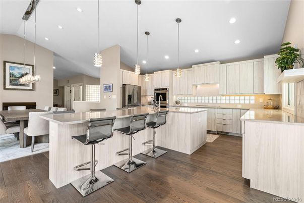 Dining room, Interior, Kitchen, Pendant Lights, Recessed Lighting, Stainless Steel Appliances, Wood Texture Flooring