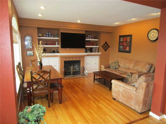 Dining room, Fireplace, Interior, Living room, Recessed Lighting, Wood Texture Flooring