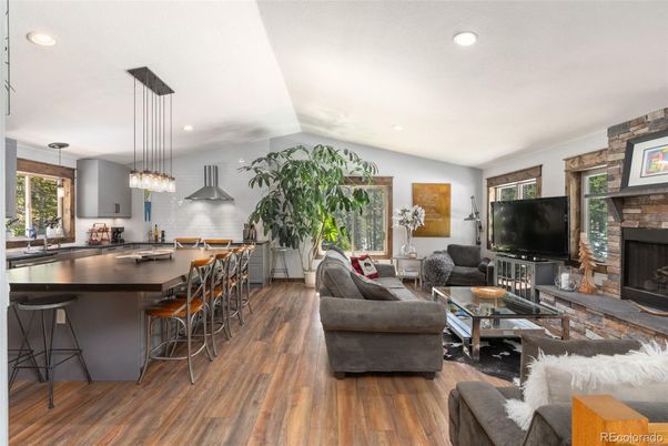 Fireplace, Interior, Kitchen, Living room, Pendant Lights, Recessed Lighting, Stone Walls, Wood Texture Flooring