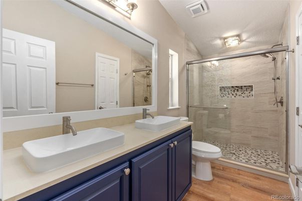 Bathroom, Dual Sink Vanities, Glass Shower, Interior, Wood Texture Flooring
