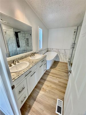 Bathroom, Dual Sink Vanities, Interior, Marble Walls, Wood Texture Flooring
