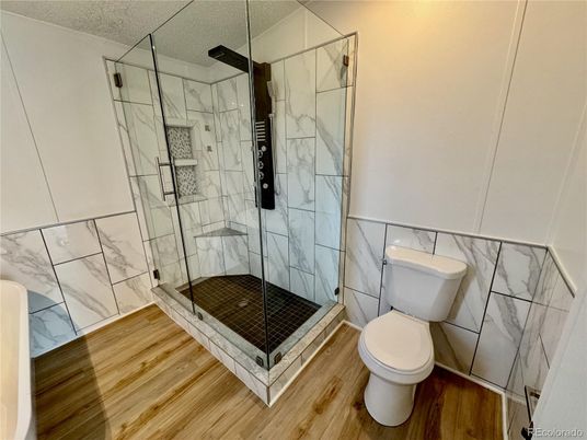 Bathroom, Glass Shower, Interior, Marble Walls, Wood Texture Flooring