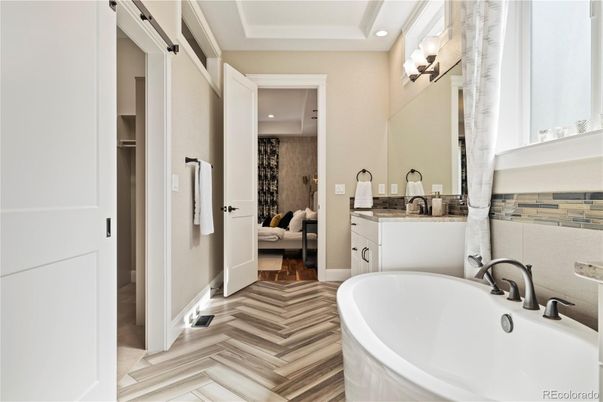 Bathroom, Dual Sink Vanities, Free Standing Baths, Interior, Recessed Lighting, Wood Texture Flooring