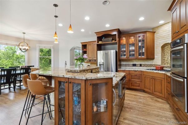 Dining room, Interior, Kitchen, Pendant Lights, Recessed Lighting, Stainless Steel Appliances, Wood Texture Flooring