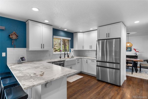 Dining room, Interior, Kitchen, Pendant Lights, Recessed Lighting, Stainless Steel Appliances, Wood Texture Flooring