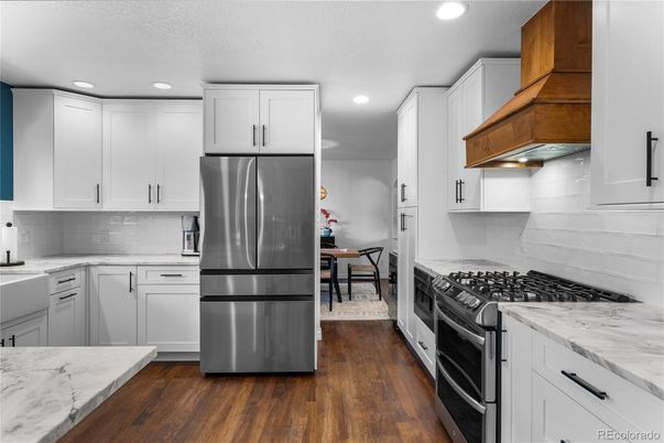 Dining room, Interior, Kitchen, Recessed Lighting, Stainless Steel Appliances, Wood Texture Flooring