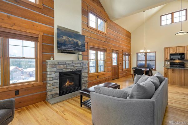 Chandelier, Dining room, Fireplace, Interior, Kitchen, Living room, Pendant Lights, Wood Texture Flooring, Wooden Walls