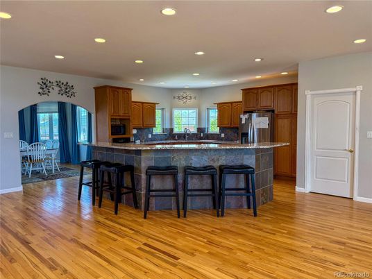 Dining room, Interior, Kitchen, Recessed Lighting, Stainless Steel Appliances, Wood Texture Flooring