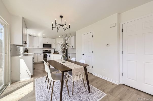 Dining room, Interior, Kitchen, Pendant Lights, Recessed Lighting, Stainless Steel Appliances, Wood Texture Flooring
