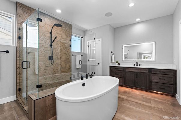 Bathroom, Dual Sink Vanities, Free Standing Baths, Glass Shower, Interior, Recessed Lighting, Wood Texture Flooring