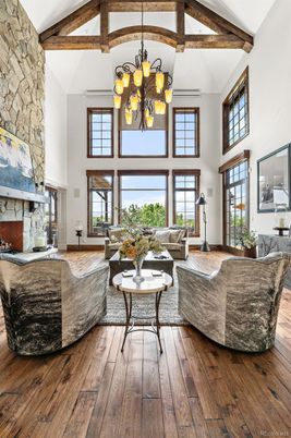 Chandelier, Fireplace, Interior, Living room, Stone Walls, Wooden Beams, Wood Texture Flooring