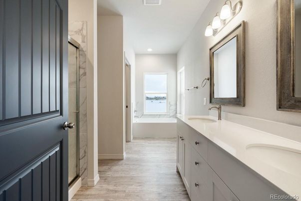 Bathroom, Dual Sink Vanities, Interior, Marble Walls, Recessed Lighting, Wood Texture Flooring