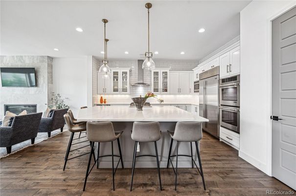 Fireplace, Interior, Kitchen, Pendant Lights, Recessed Lighting, Stainless Steel Appliances, Wood Texture Flooring