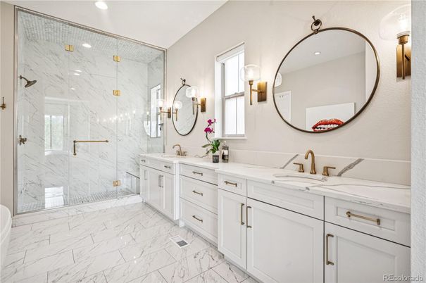 Bathroom, Dual Sink Vanities, Glass Shower, Interior, Marble, Marble Walls, Recessed Lighting