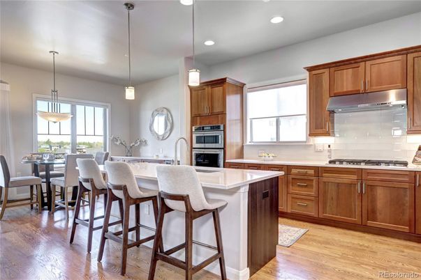 Dining room, Interior, Kitchen, Pendant Lights, Recessed Lighting, Stainless Steel Appliances, Wood Texture Flooring