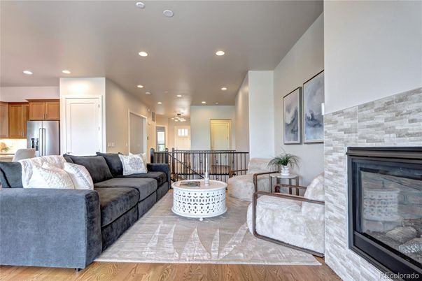 Fireplace, Interior, Kitchen, Living room, Recessed Lighting, Stainless Steel Appliances, Stone Walls, Wood Texture Flooring
