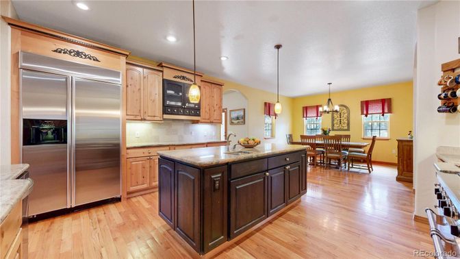 Dining room, Interior, Kitchen, Pendant Lights, Recessed Lighting, Stainless Steel Appliances, Wood Texture Flooring