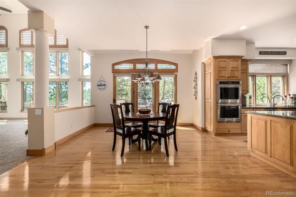 Dining room, Interior, Kitchen, Pendant Lights, Recessed Lighting, Stainless Steel Appliances, Wood Texture Flooring