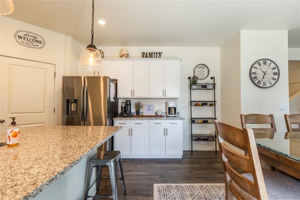 Dining room, Interior, Kitchen, Pendant Lights, Recessed Lighting, Stainless Steel Appliances, Wood Texture Flooring