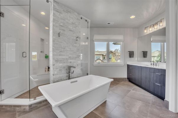 Bathroom, Dual Sink Vanities, Free Standing Baths, Glass Shower, Interior, Recessed Lighting, Stone Walls