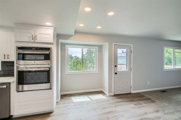 Interior, Kitchen, Recessed Lighting, Stainless Steel Appliances, Wood Texture Flooring