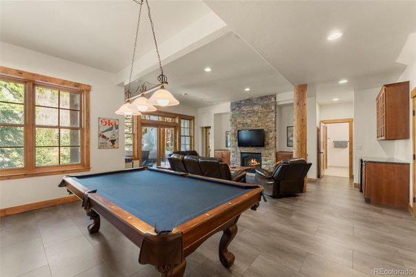 Billiard Table, Fireplace, Game Room, Interior, Pendant Lights, Recessed Lighting, Stone Walls