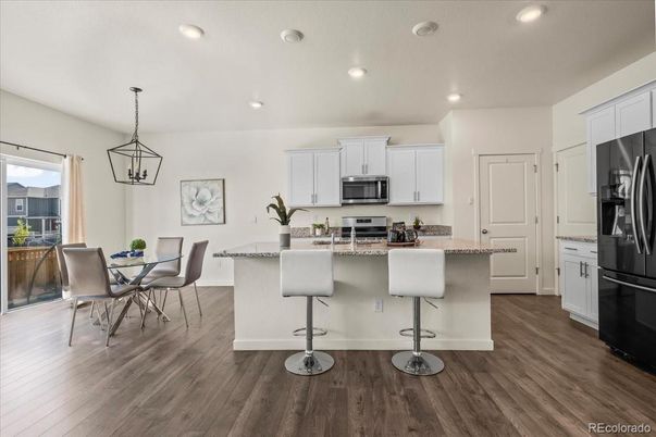 Dining room, Interior, Kitchen, Pendant Lights, Recessed Lighting, Stainless Steel Appliances, Wood Texture Flooring