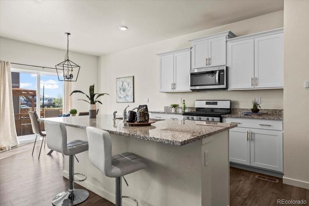 Dining room, Interior, Kitchen, Pendant Lights, Recessed Lighting, Stainless Steel Appliances, Wood Texture Flooring
