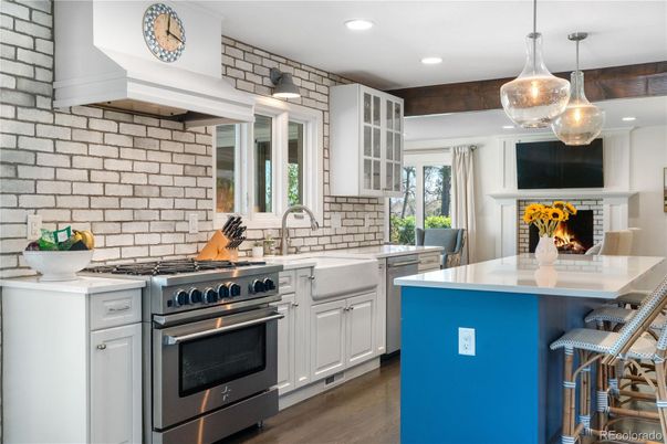 Fireplace, Interior, Kitchen, Pendant Lights, Recessed Lighting, Stainless Steel Appliances, Stone Walls, Wood Texture Flooring